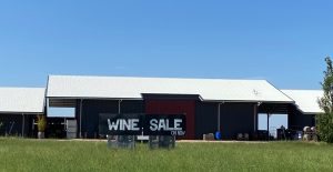 Shed At Michael Unwin Wines with Wine Sale sign in front